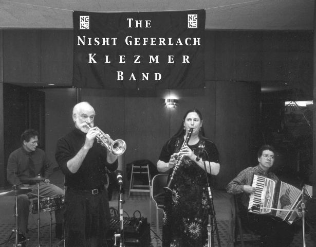 Historic black-and-white photograph of the Nisht Geferlach Klezmer Band performing